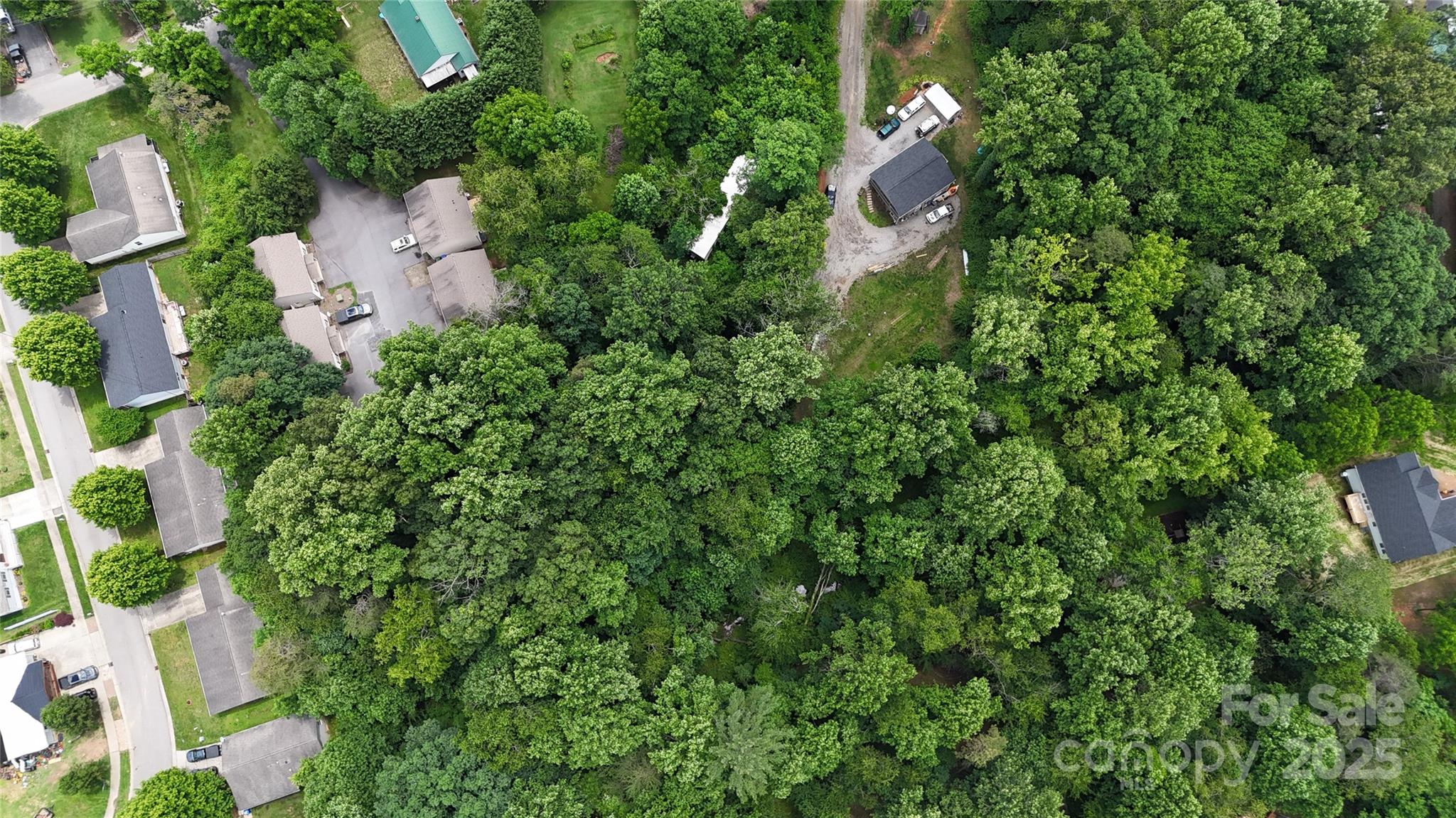 23 Maple Avenue Candler, NC 28715 - Photo 2 of 16 an aerial view of residential house with outdoor space and trees all around