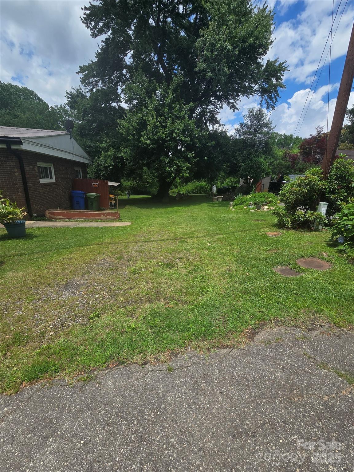 23 Maple Avenue Candler, NC 28715 - Photo 4 of 16 a view of a house with backyard
