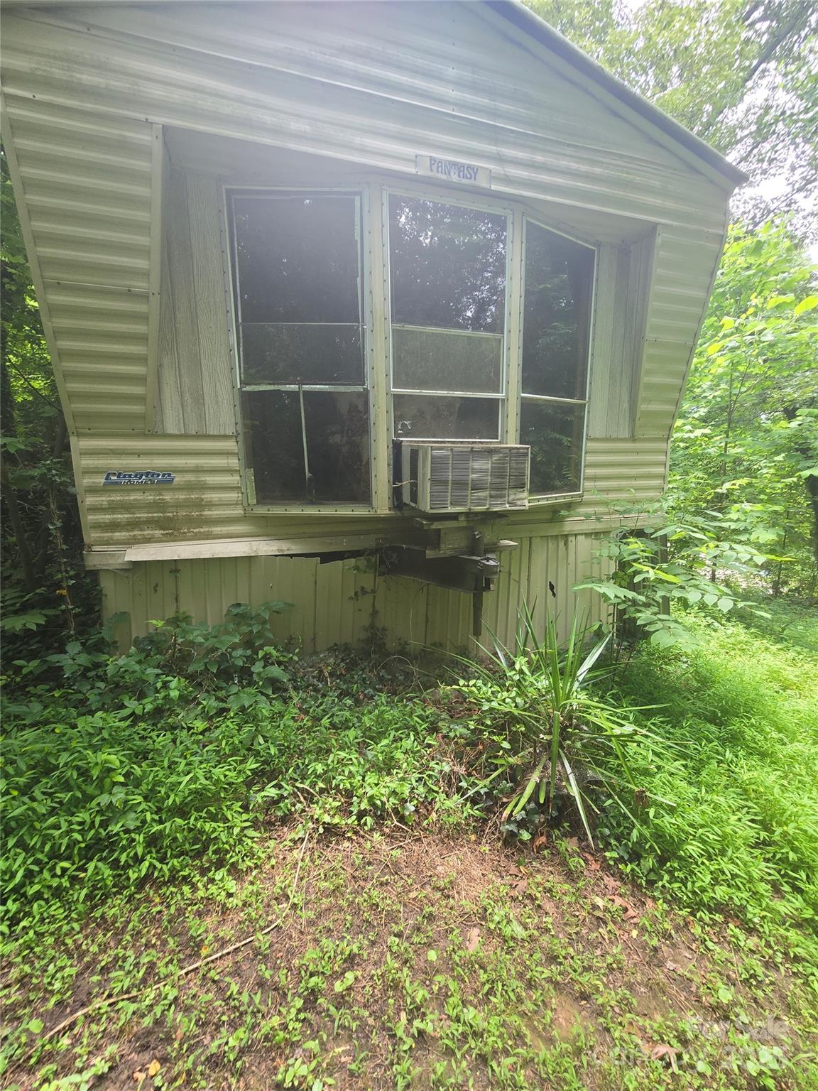 23 Maple Avenue Candler, NC 28715 - Photo 6 of 16 a view of a house with a window