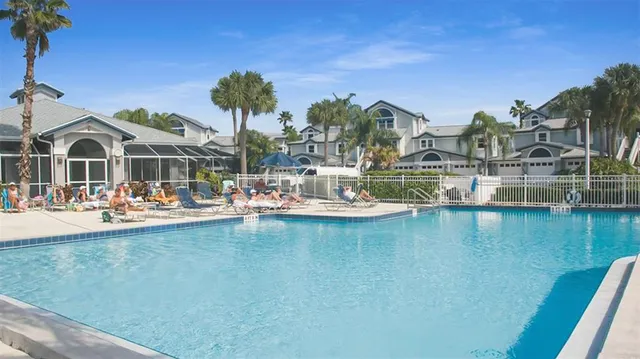 a view of a swimming pool with a table and chairs