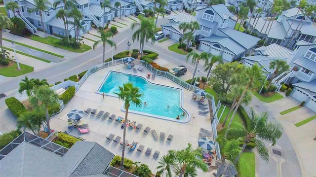 an aerial view of a house with a yard and garden