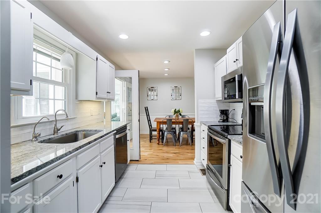 2375 Whitley Road Fort Mill, SC 29708 - Photo 11 of 35 a kitchen with stainless steel appliances granite countertop a sink stove and refrigerator