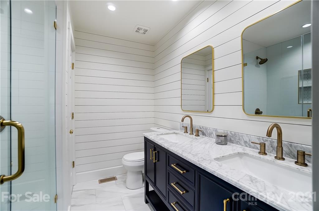 2375 Whitley Road Fort Mill, SC 29708 - Photo 20 of 35 a bathroom with a granite countertop sink toilet and shower