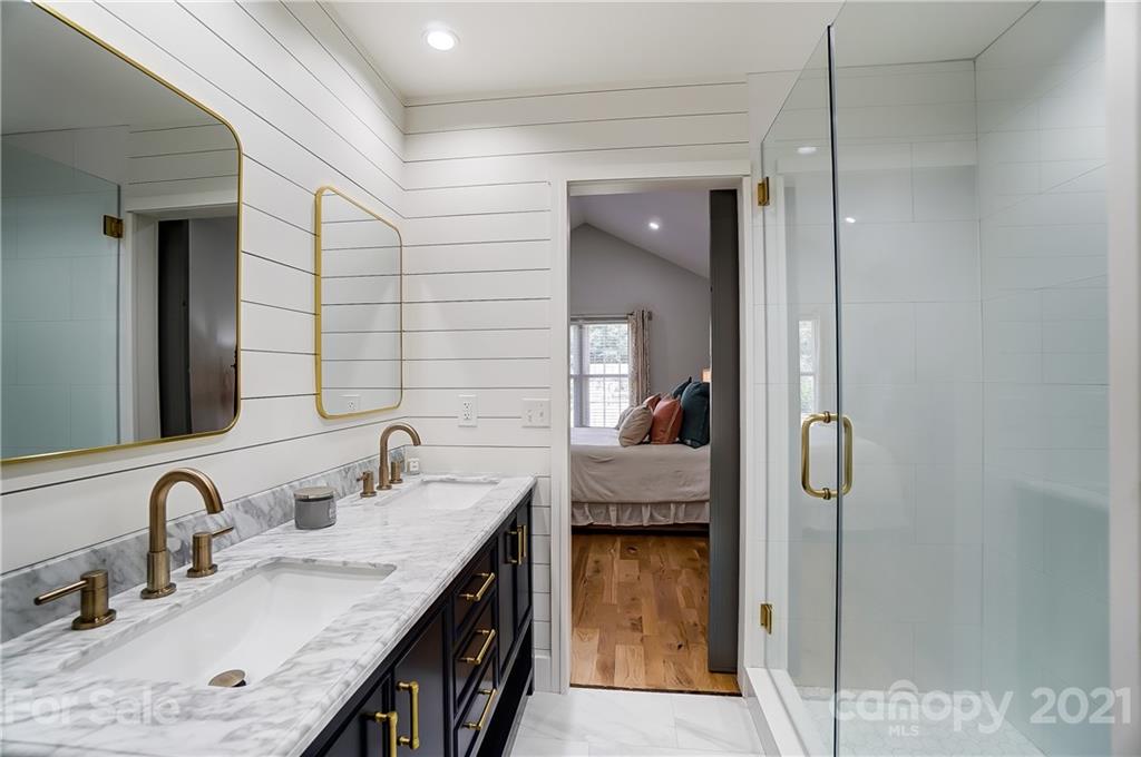 2375 Whitley Road Fort Mill, SC 29708 - Photo 21 of 35 a en suite bathroom with a granite countertop sink and mirror