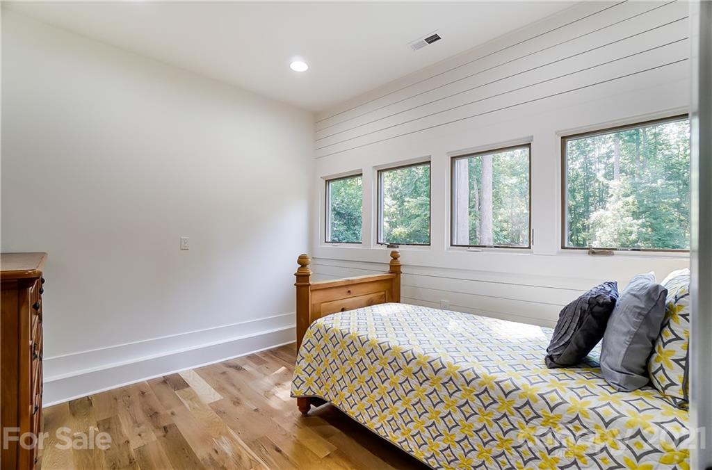 2375 Whitley Road Fort Mill, SC 29708 - Photo 28 of 35 a bedroom with a bed and two windows