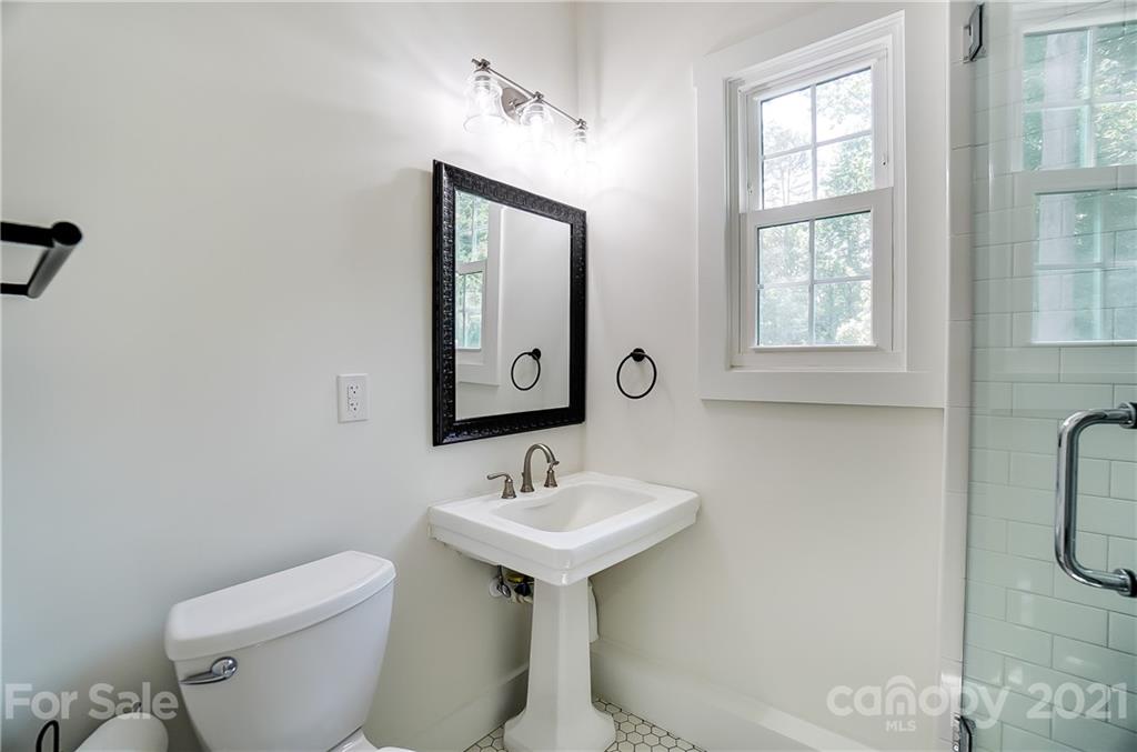 2375 Whitley Road Fort Mill, SC 29708 - Photo 31 of 35 a bathroom with a toilet sink and mirror