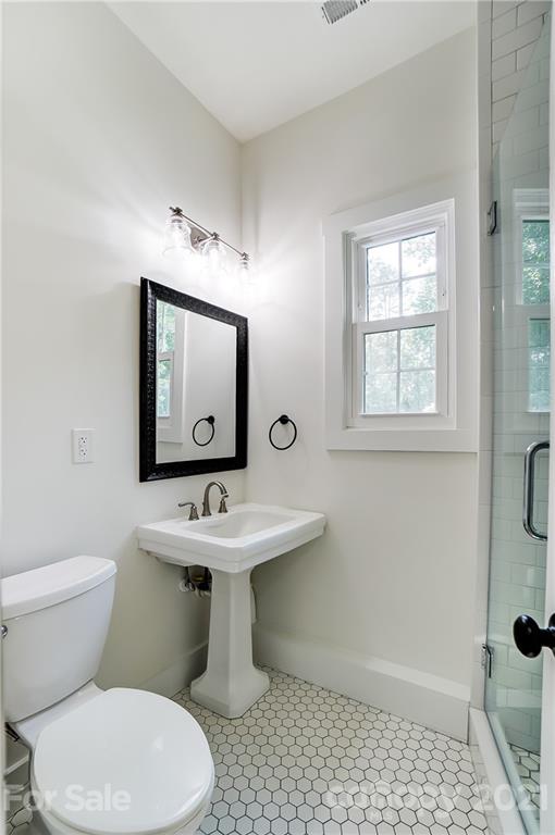 2375 Whitley Road Fort Mill, SC 29708 - Photo 32 of 35 a bathroom with a toilet sink and mirror