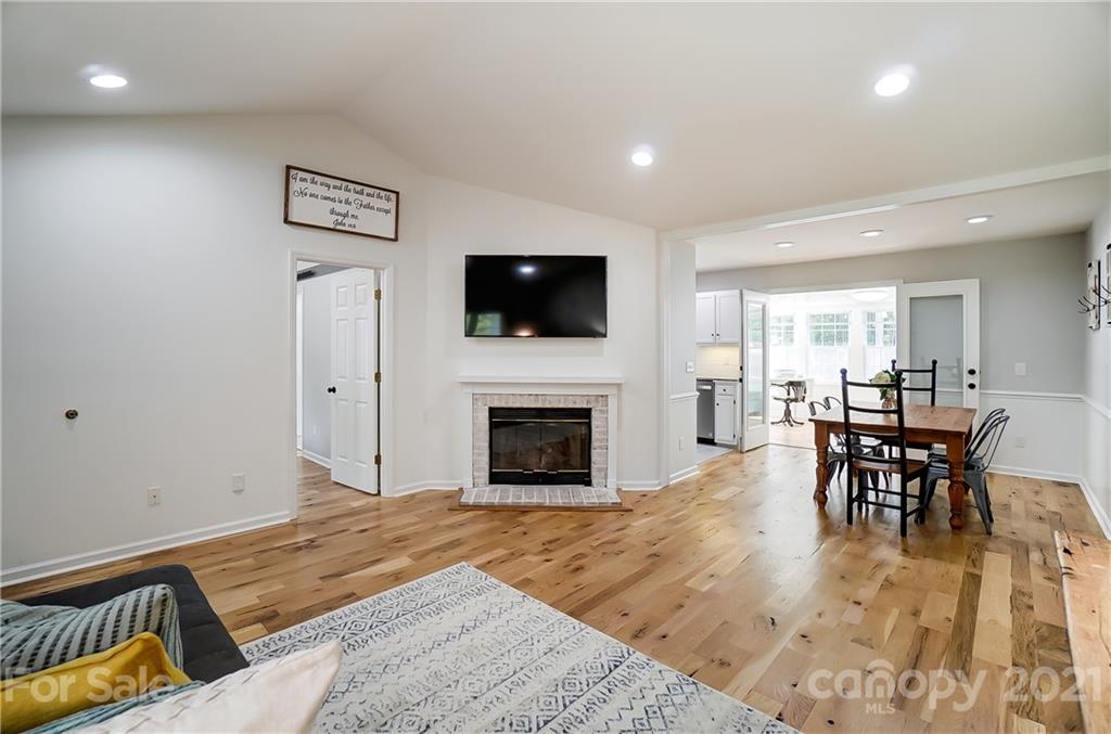 2375 Whitley Road Fort Mill, SC 29708 - Photo 5 of 35 a living room with furniture a fireplace and a flat screen tv