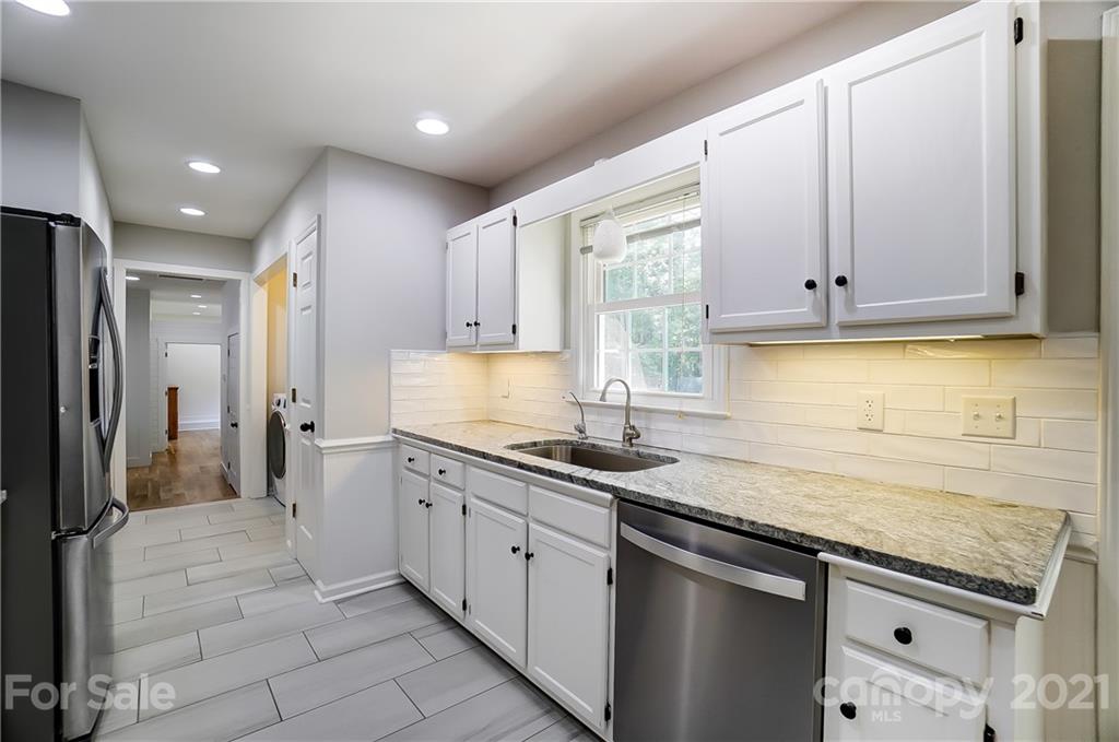 2375 Whitley Road Fort Mill, SC 29708 - Photo 9 of 35 a kitchen with a sink stove and cabinets