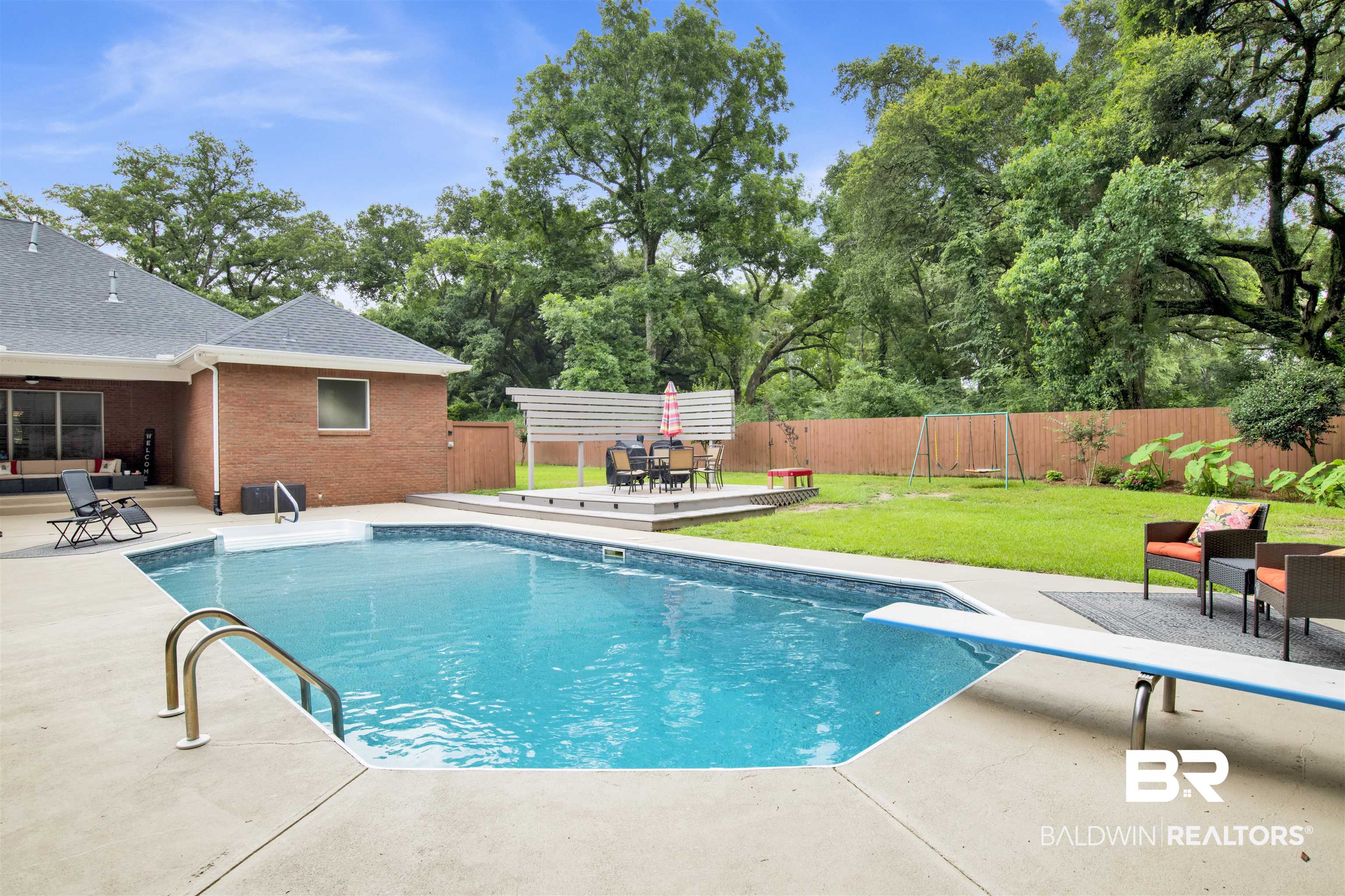 4340 Hamilton Oaks Lane Mobile, AL 36695 - Photo 39 of 51 View of pool featuring a yard, a diving board, and a patio area