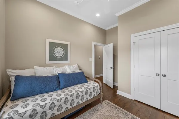 a bedroom with a bed and a painting