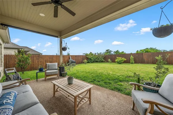 a view of yard with outdoor seating and green space