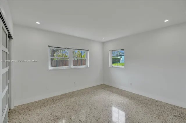 an empty room with windows