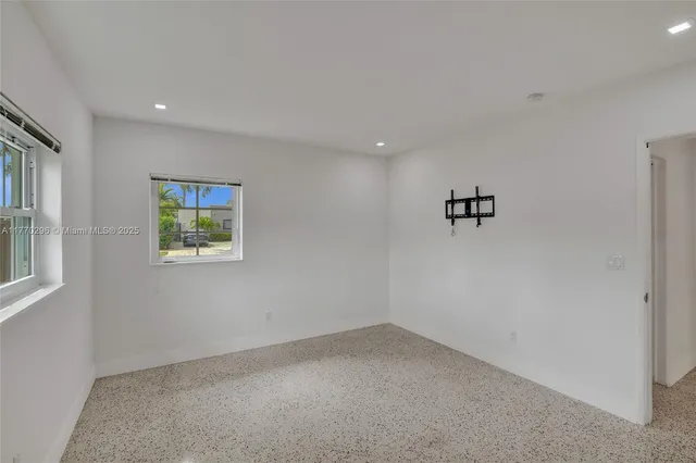 a view of a room with a white walls