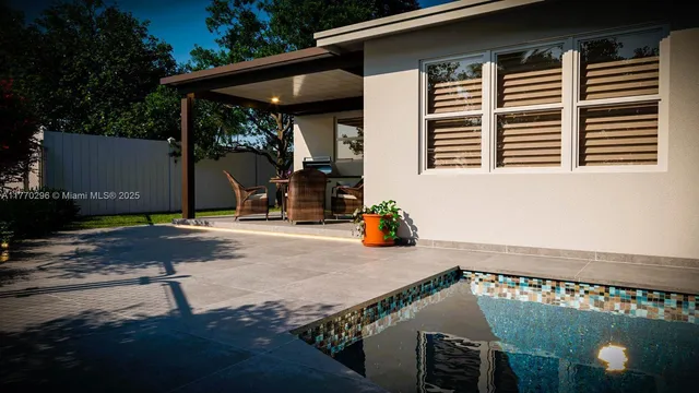 a view of a chair and tables in patio of the house
