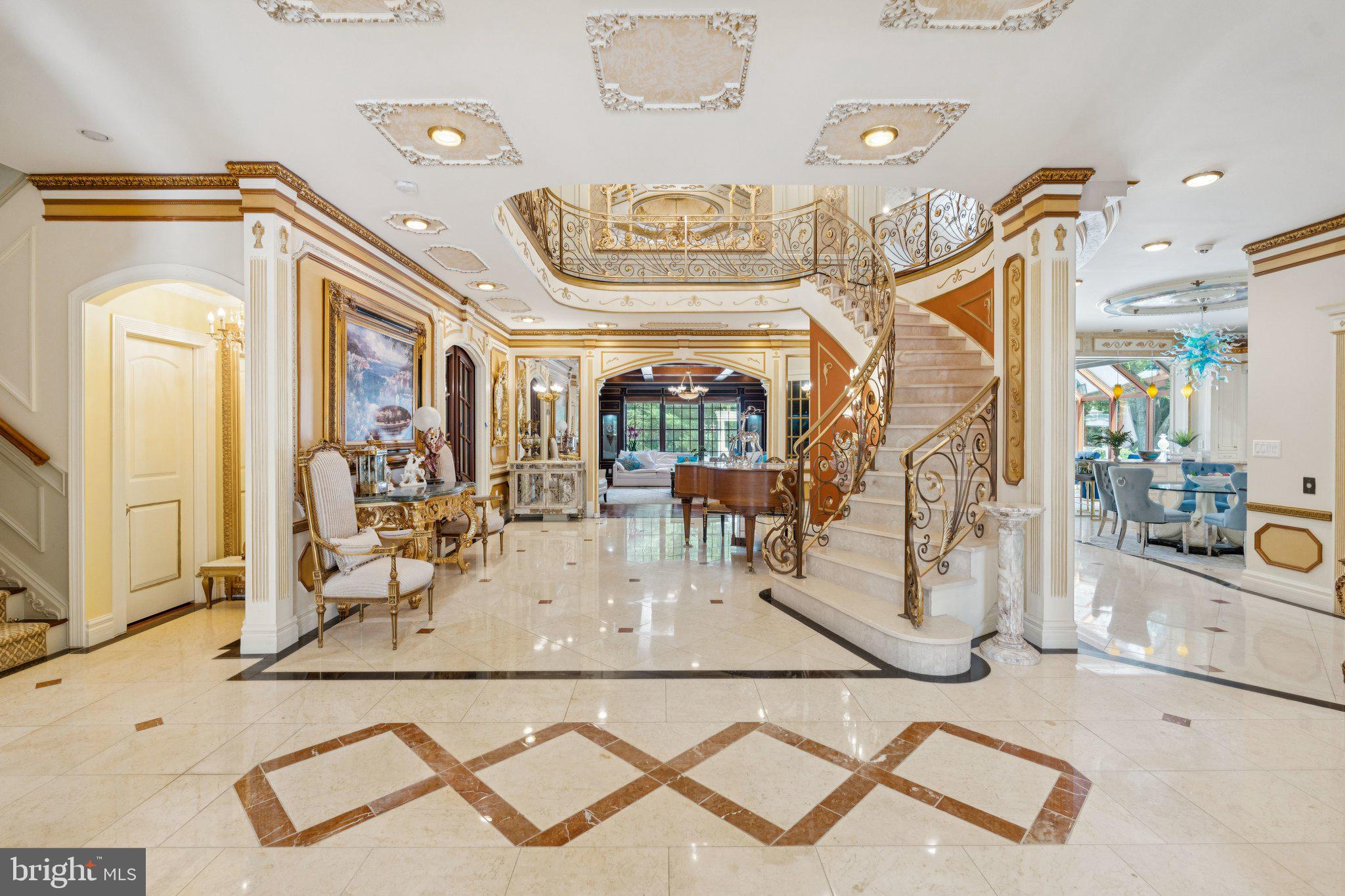 423 Seneca Road Great Falls, VA 22066 - Photo 13 of 55 a view of a dining room with furniture a chandelier and wooden floor