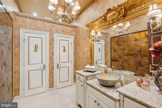 a kitchen with stainless steel appliances kitchen island granite countertop a refrigerator and a sink