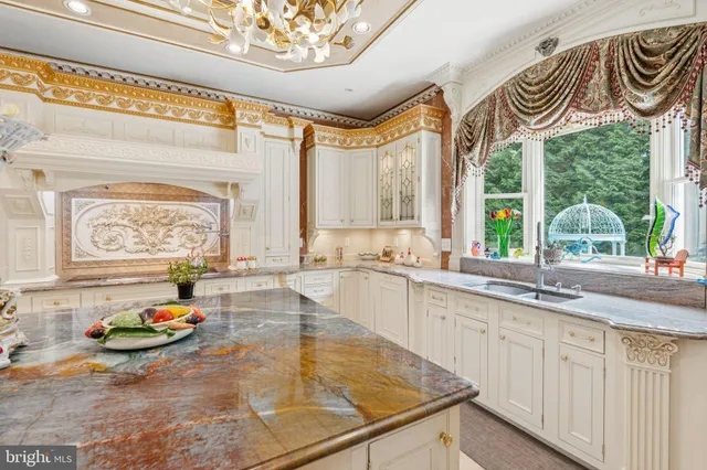 a dining room with furniture and a large window