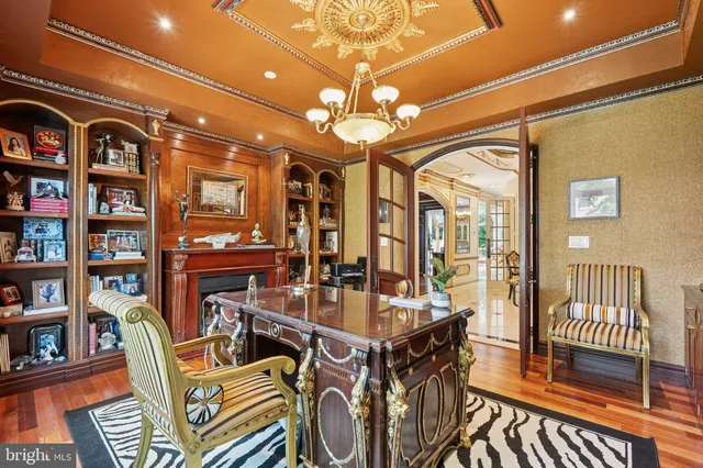 a view of a dining room with furniture and a chandelier