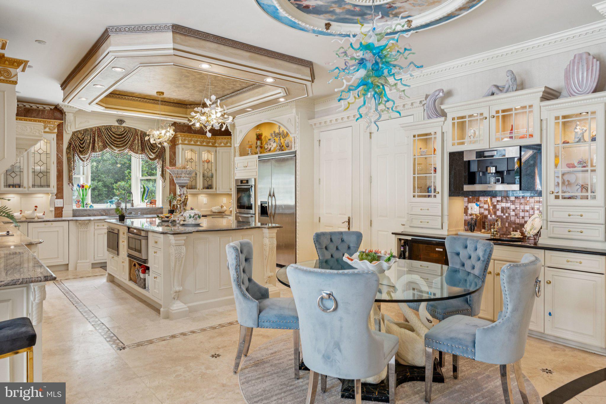423 Seneca Road Great Falls, VA 22066 - Photo 20 of 55 a dining room filled counter top space and a dining table with kitchen view