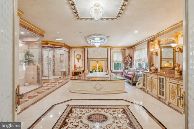 a living room with stainless steel appliances furniture and a view of kitchen