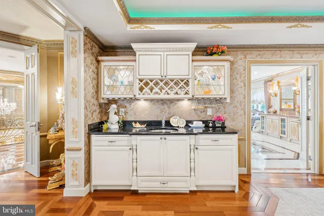 a spacious bathroom with a granite countertop tub a mirror and a shower