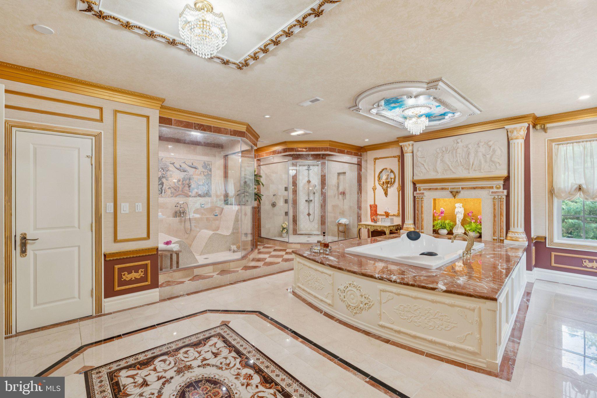 423 Seneca Road Great Falls, VA 22066 - Photo 31 of 52 a spacious bathroom with a granite countertop tub a mirror and a shower