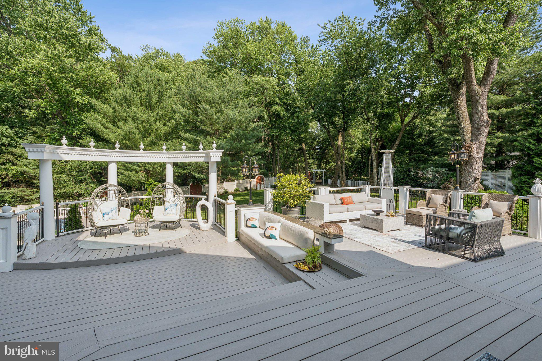423 Seneca Road Great Falls, VA 22066 - Photo 44 of 52 a outdoor space with patio the couches and a dining table with garden view
