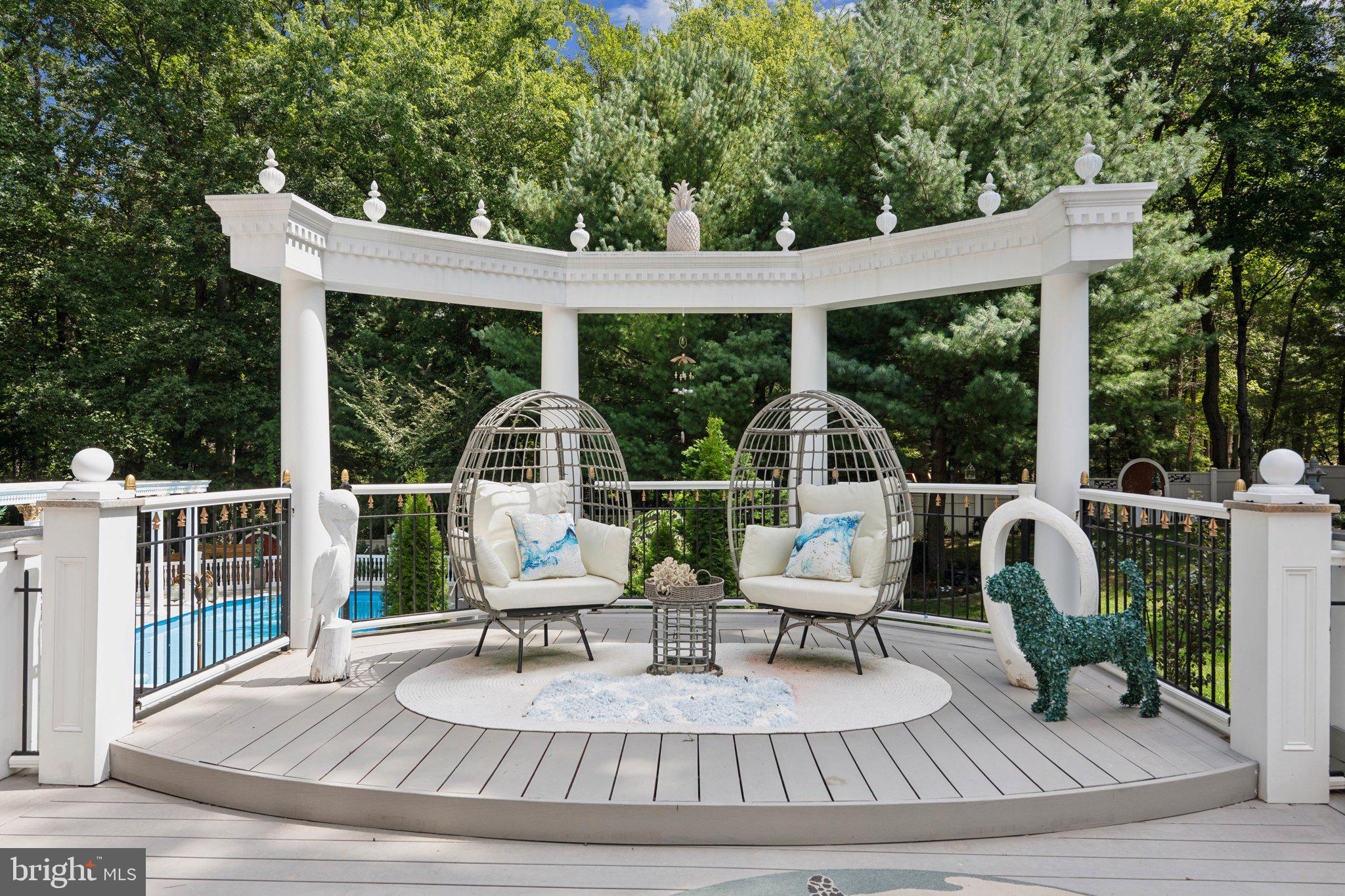 423 Seneca Road Great Falls, VA 22066 - Photo 45 of 55 a view of patio with table and chairs potted plants with wooden floor and fence
