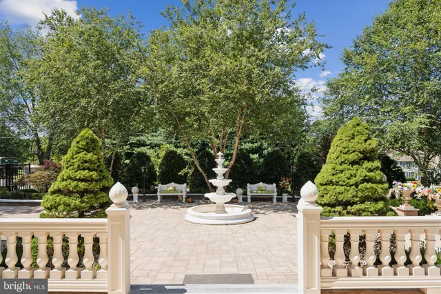 a view of a backyard with swimming pool
