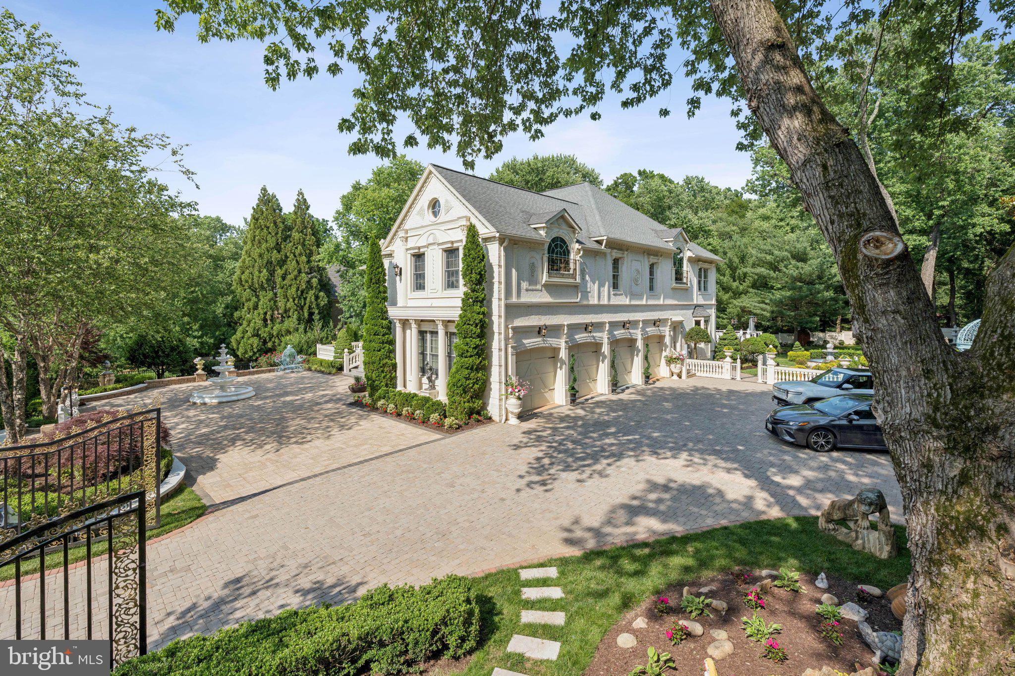 423 Seneca Road Great Falls, VA 22066 - Photo 6 of 55 a front view of a house with a garden