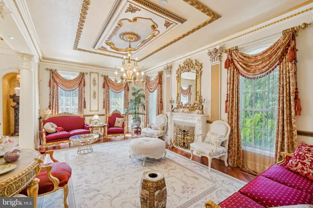 a dining room with furniture and a chandelier