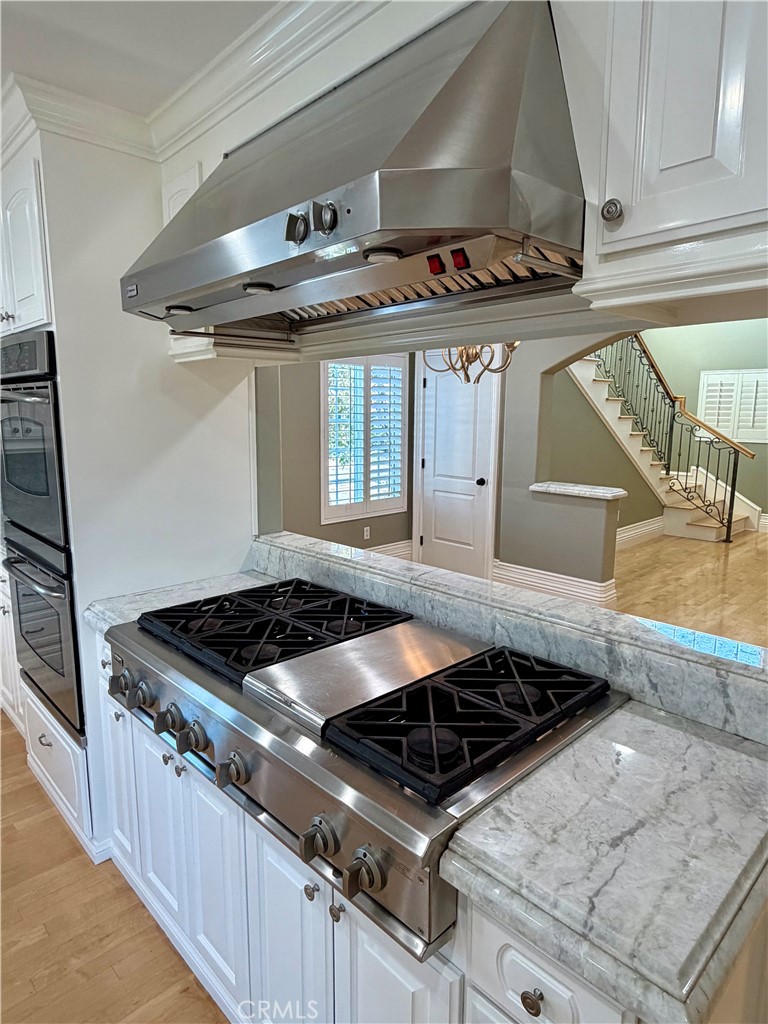 5243 East Arbor Road Long Beach, CA 90808 - Photo 12 of 46 a stove top oven sitting inside of a kitchen