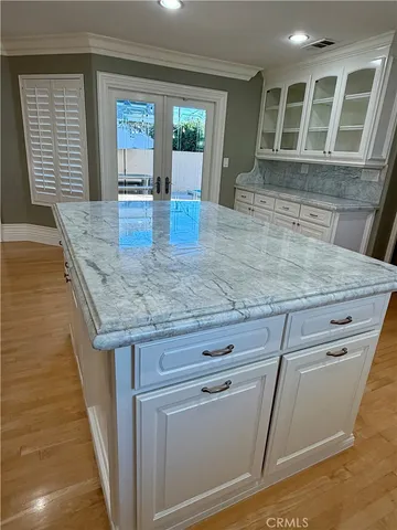 a view of kitchen with granite countertop window