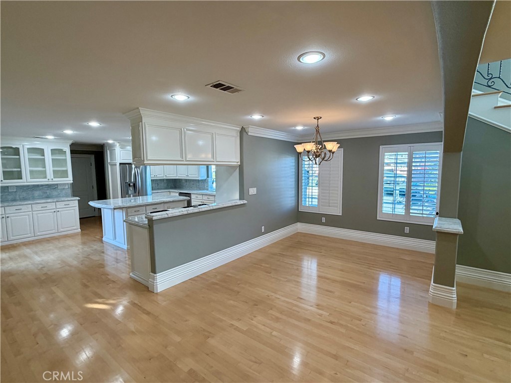 5243 East Arbor Road Long Beach, CA 90808 - Photo 16 of 46 a large kitchen with stainless steel appliances granite countertop a large counter top a sink and a refrigerator