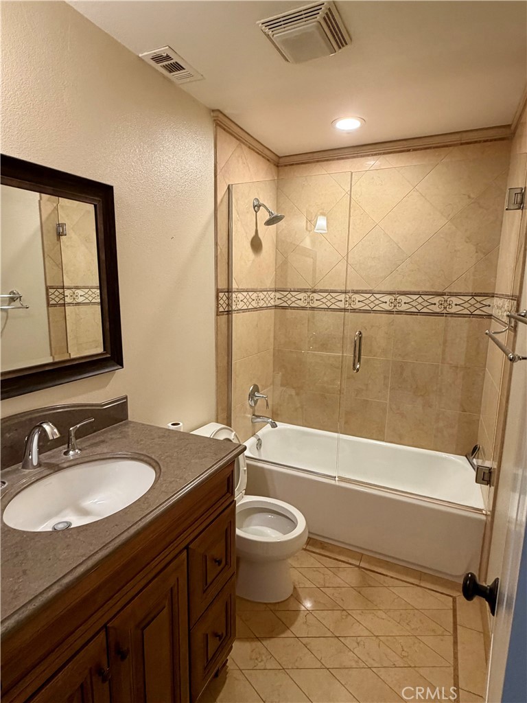 5243 East Arbor Road Long Beach, CA 90808 - Photo 20 of 46 a bathroom with a granite countertop sink toilet and shower