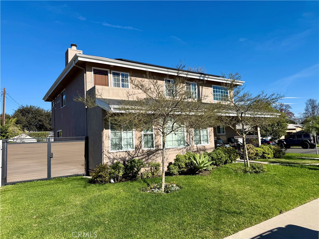 5243 East Arbor Road Long Beach, CA 90808 - Photo 2 of 46 a front view of a house with a yard