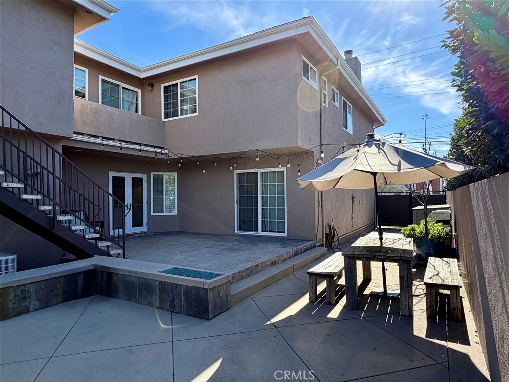 5243 East Arbor Road Long Beach, CA 90808 - Photo 3 of 46 a view of house with a chairs and table in kitchen