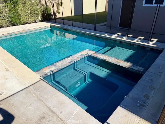 a view of a pool with a yard