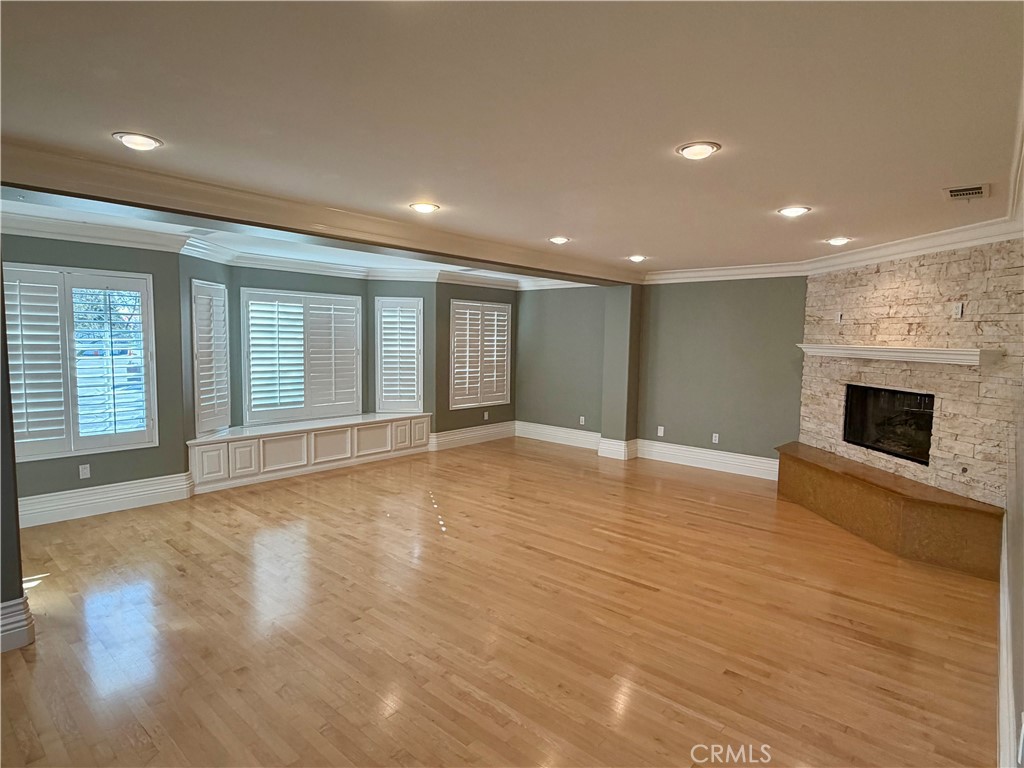 5243 East Arbor Road Long Beach, CA 90808 - Photo 4 of 46 a view of an empty room with wooden floor and a window