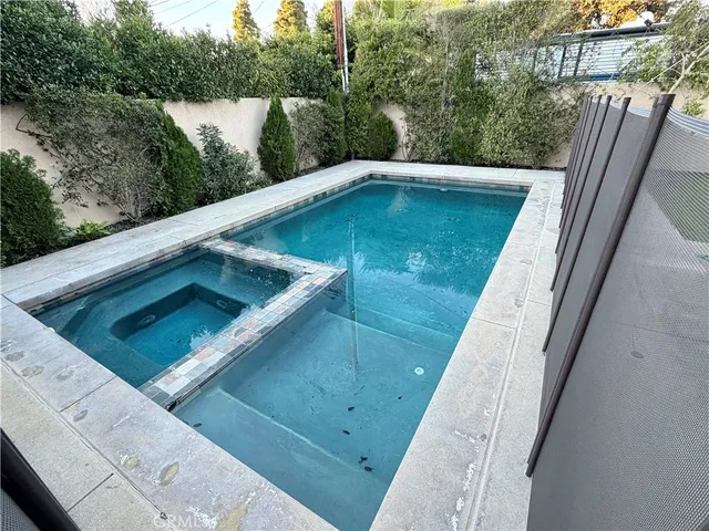 a view of swimming pool from a balcony
