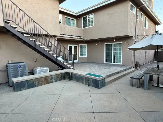 a view of a house with roof and sitting area
