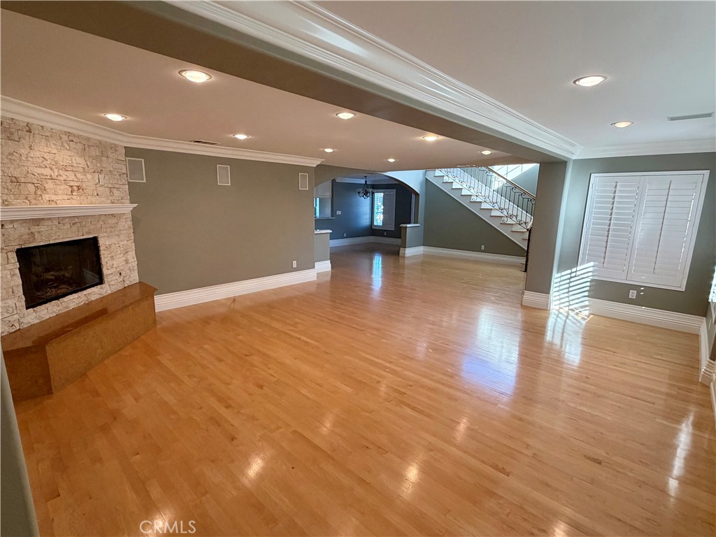 5243 East Arbor Road Long Beach, CA 90808 - Photo 5 of 46 a view of empty room with wooden floor and fireplace