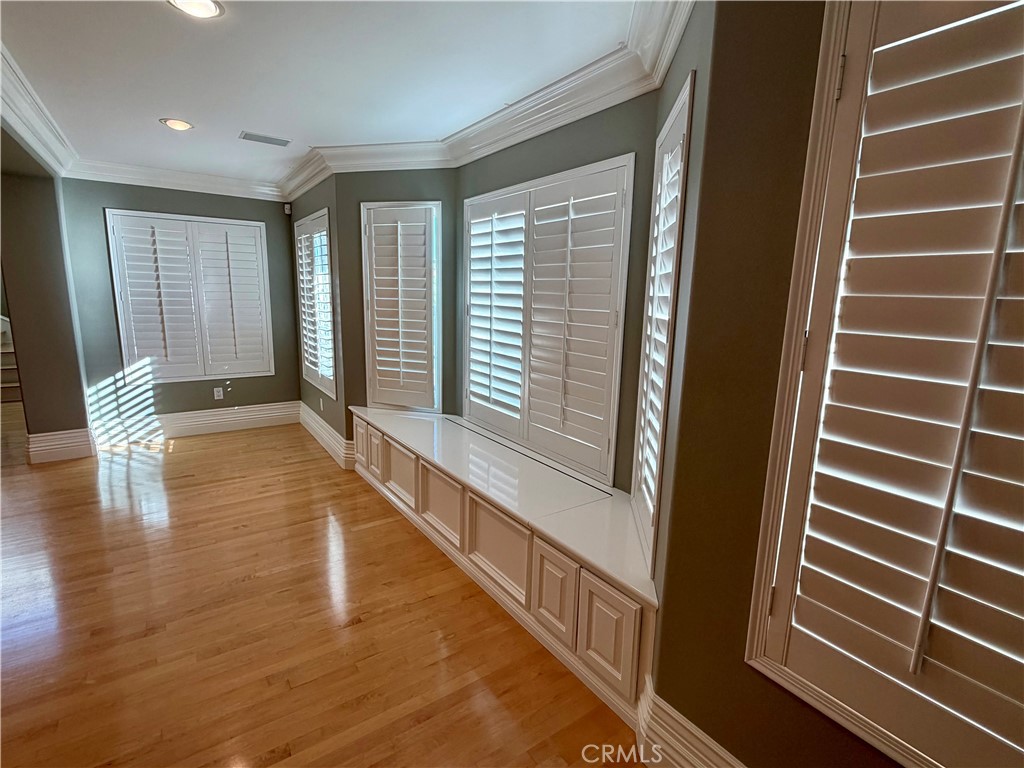 5243 East Arbor Road Long Beach, CA 90808 - Photo 6 of 46 a view of an empty room with wooden floor and a window