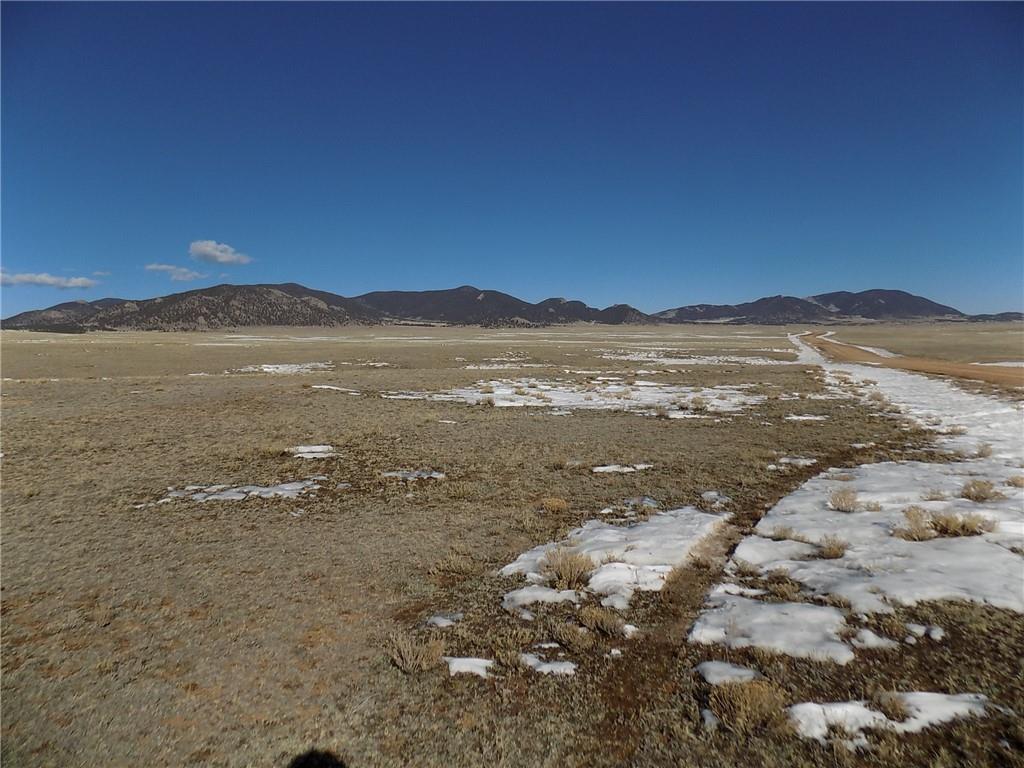 6287 Larimer Road Hartsel, CO 80449 - Photo 6 of 7 a view of an lake with a mountain