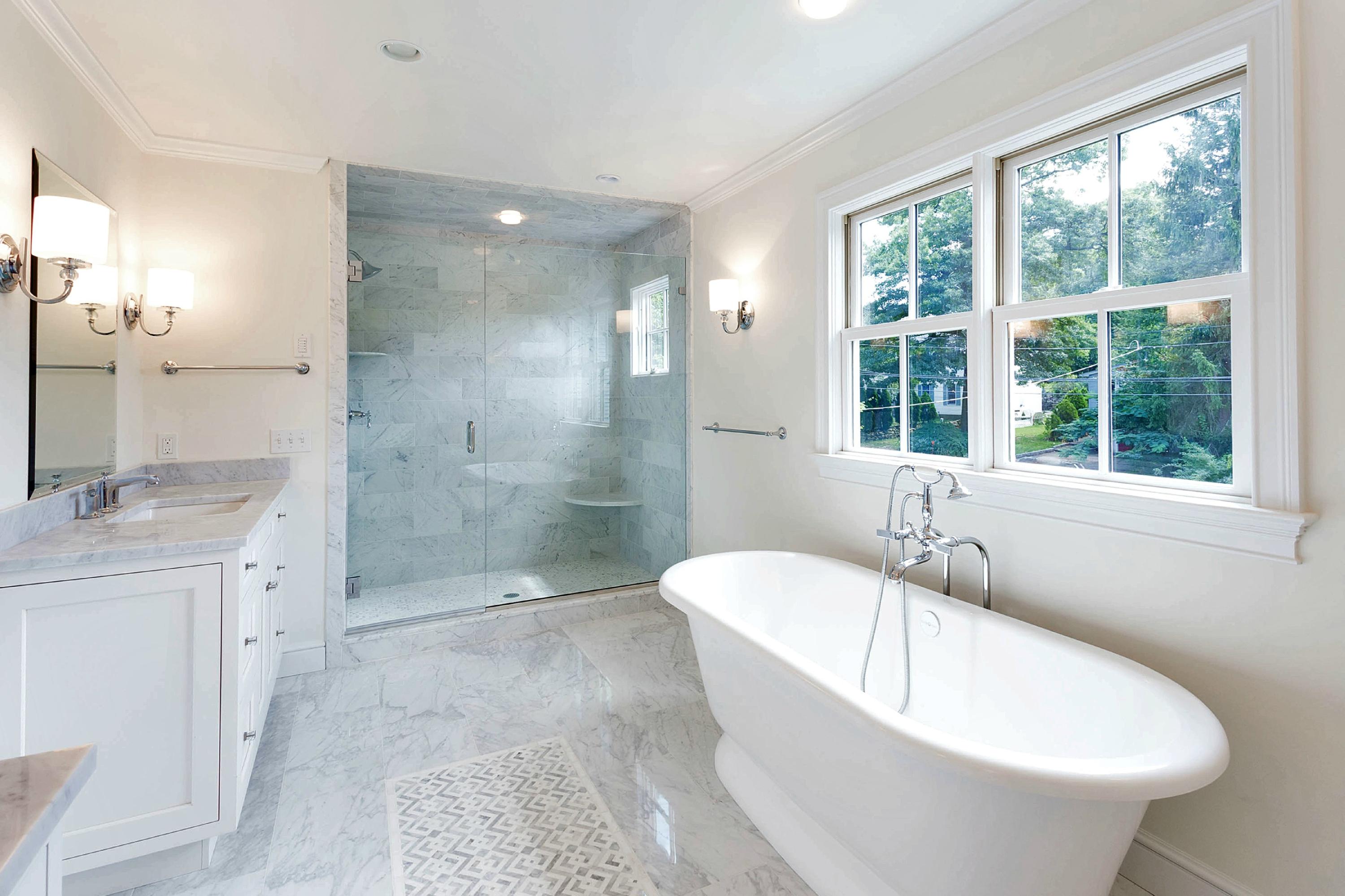 18 Edgewood Road Darien, CT 06820 - Photo 22 of 38 a spacious bathroom with a bathtub and sink