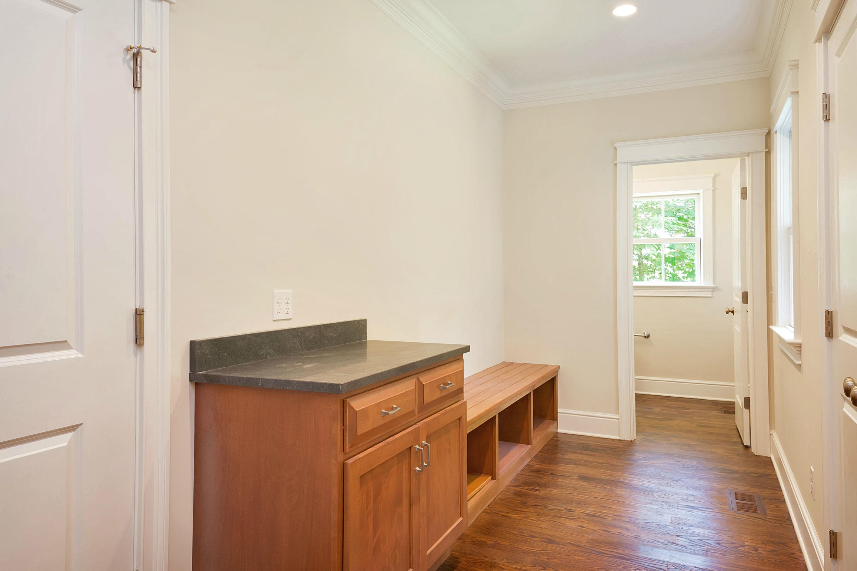 18 Edgewood Road Darien, CT 06820 - Photo 8 of 38 a hallway with cabinets