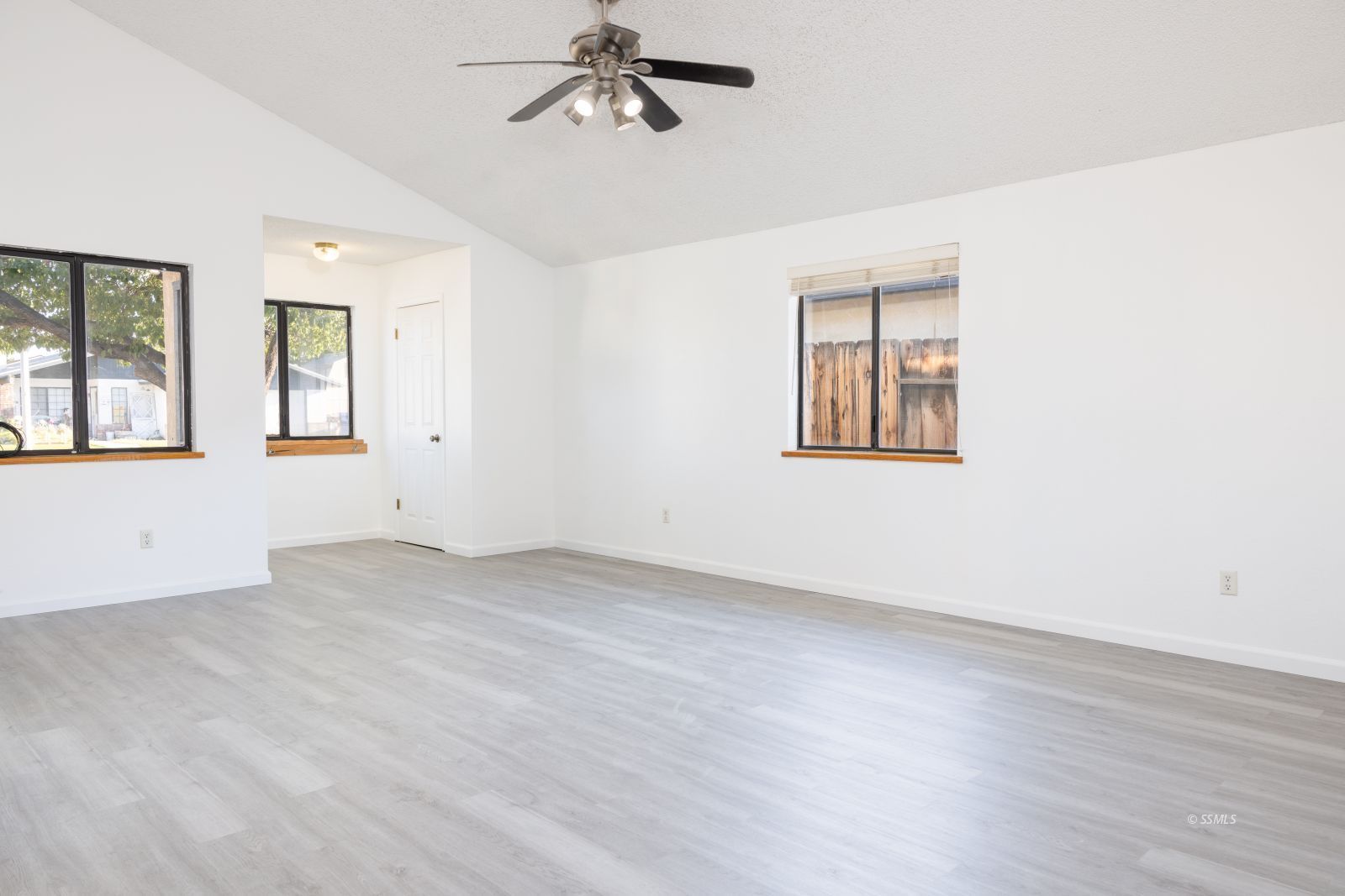 820 Walker Lane Ridgecrest, CA 93555 - Photo 8 of 27 wooden floor in an empty room with a window