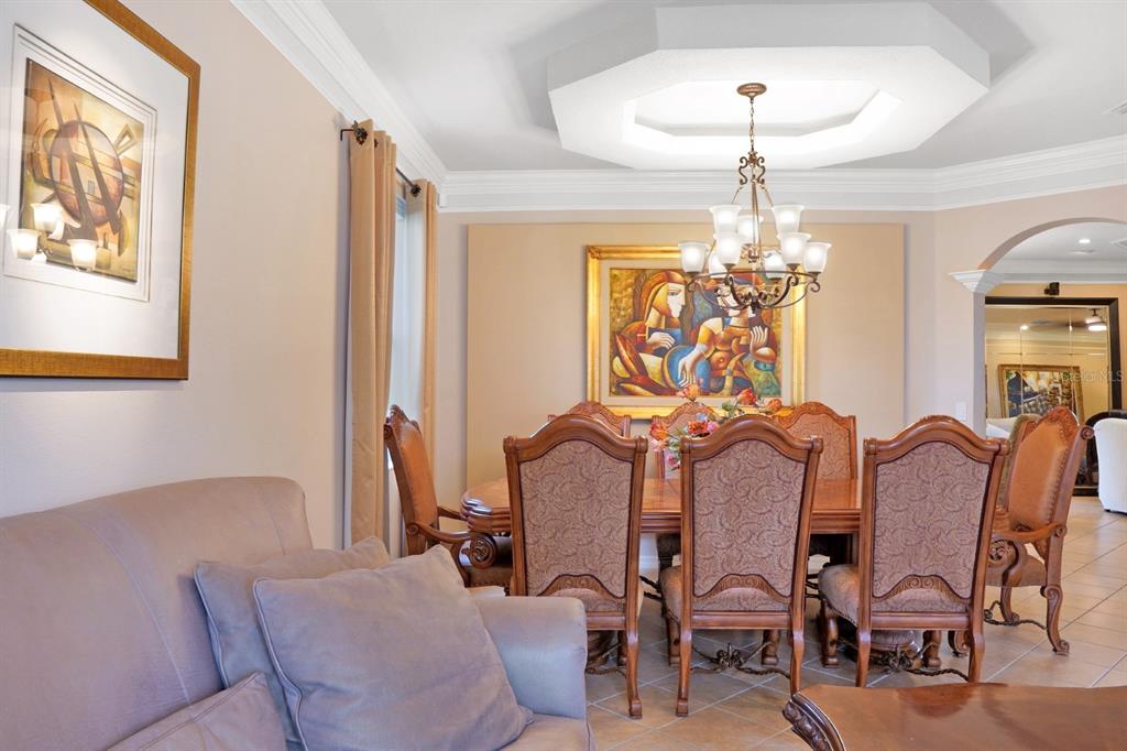 124 Spring Glen Drive DeBary, FL 32713 - Photo 11 of 40 a view of a dining room with furniture and chandelier