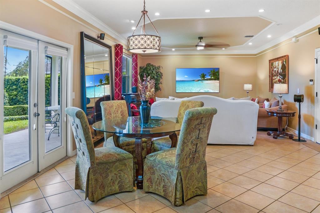 124 Spring Glen Drive DeBary, FL 32713 - Photo 14 of 40 a dining room with furniture a chandelier and window